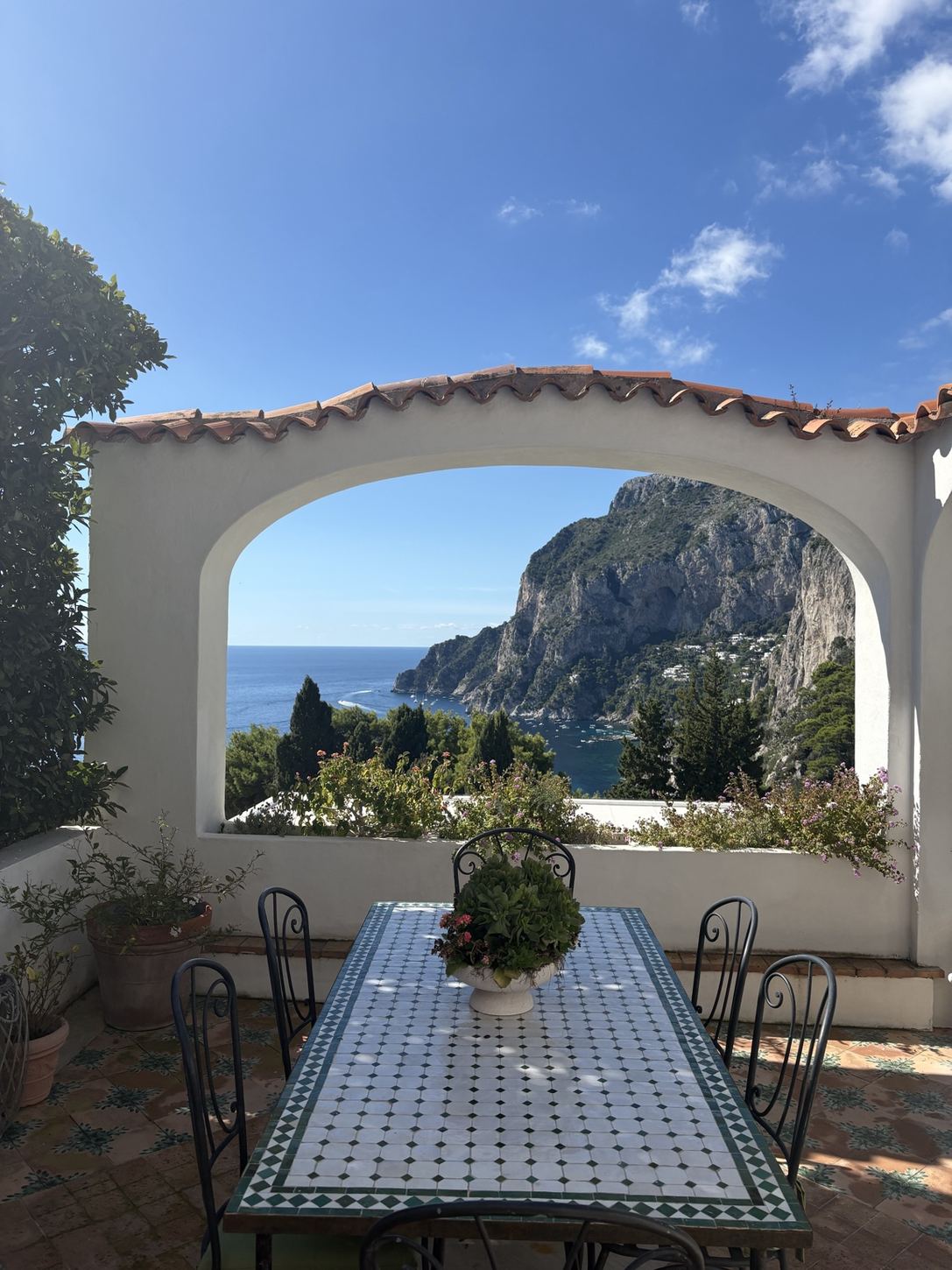 A sunlit Italian terrace overlooking the Mediterranean